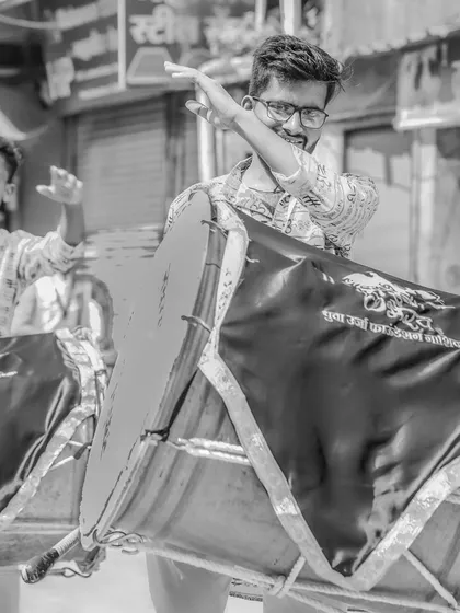 The black and white version of the playful dhol player.