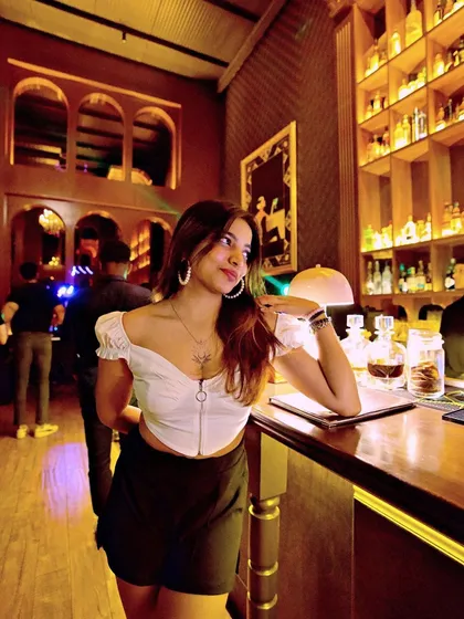A guest looking chic at the bar.