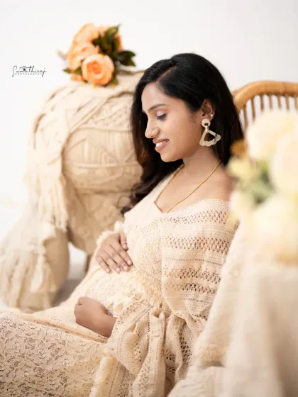 A close-up, artistic shot of a mother-to-be in our boho setup. The focus on her serene expression and the soft textures creates a beautiful and soulful portrait.