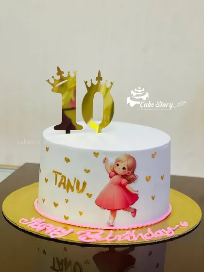 A pretty cake for a 10th birthday. The simple white design is personalized with the birthday girl's name and a cute illustration.
