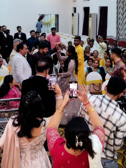 A candid shot of the guests enjoying the couple's entry. My goal as a wedding emcee is to keep everyone engaged and make them feel like a part of the celebration.