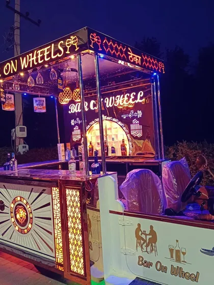 Our 'Bar on Wheels' fully stocked and ready for service. This setup is not just a novelty; it's a highly functional bar station that allows our mixologists to work efficiently and serve guests quickly.