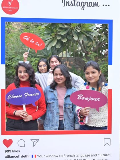 A group of happy visitors poses with fun props at our Instagram-themed photo booth. Our Open Days are all about creating joyful memories and a welcoming atmosphere.