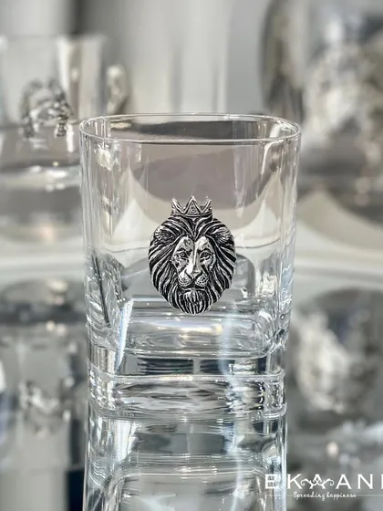 A whiskey glass for the king of the castle. This glass features a bold, silver-plated lion head emblem, crowned and majestic. It is a statement piece for any home bar.