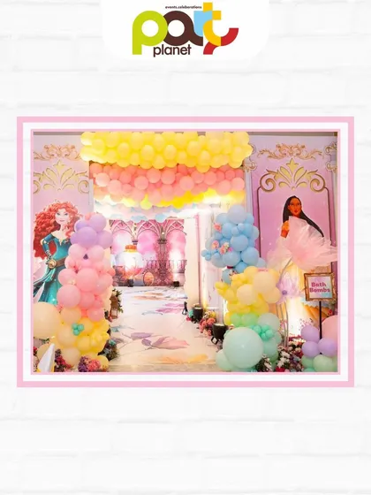 A grand entrance to a princess party, adorned with pastel balloon arches and character cutouts, welcoming guests to a world of magic.