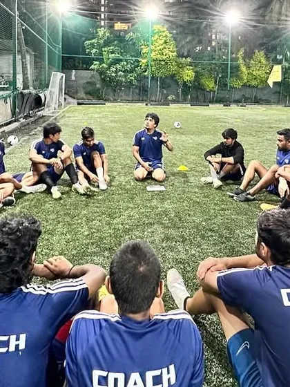Our strength is our team of over 55 licensed coaches. Here we are in a strategy session, constantly working to improve our methods. We are not just coaches, we are a team dedicated to mentoring the next generation.