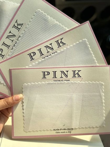 Fabric cards from Thomas Pink, showcasing their fine white shirting materials. We bring these samples to you to feel the quality firsthand.