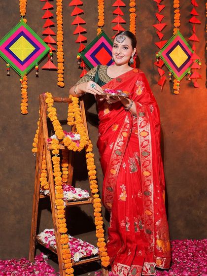 An entire Diwali-themed shoot featuring our red Banarasi saree. This series shows a complete concept, from decor to final look, providing rich inspiration for festive content.