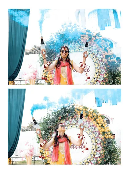 The pure fun and vibrancy of a Haldi ceremony. The bride celebrates with blue color smoke bombs, creating a dynamic and joyful photograph that shows the festive spirit I love to capture during wedding functions.