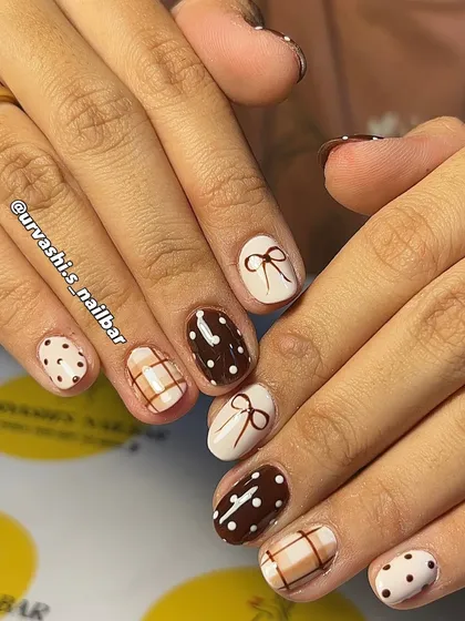 The perfect "Latte Girl" aesthetic. This cozy set features hand-painted bows, polka dots, and plaid patterns in shades of chocolate brown and cream for a look that's timelessly chic.