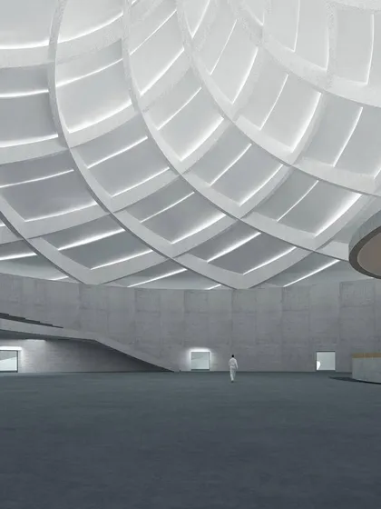 A serene design to embrace the orisons. This conceptual render shows a large, open prayer hall with a magnificent coffered dome ceiling that filters light, creating a tranquil and spiritual atmosphere.