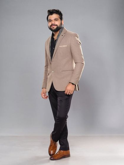 Another confident pose from Kshitish Date, showcasing the versatility of a well-styled blazer.