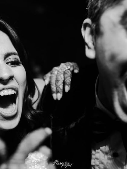Pure, uninhibited joy! This close-up of guests laughing and shouting on the dance floor captures the soul of the party.