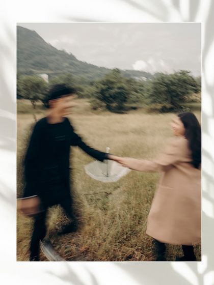An artistic shot using motion blur as the couple walks through a field. This creative technique adds a sense of dreaminess and movement to their love story.