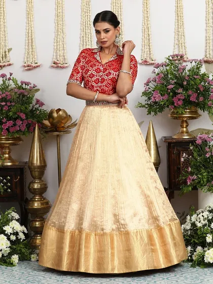 The full look of the beige lehenga with the collared blouse, exuding confidence and modern style.