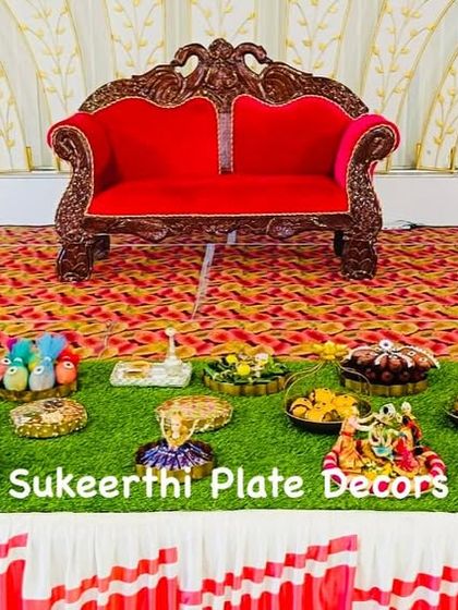 A simple yet beautiful platter arrangement for a puberty ceremony in Avinashi. The focus is on the neatly decorated seer items and a central doll figure.