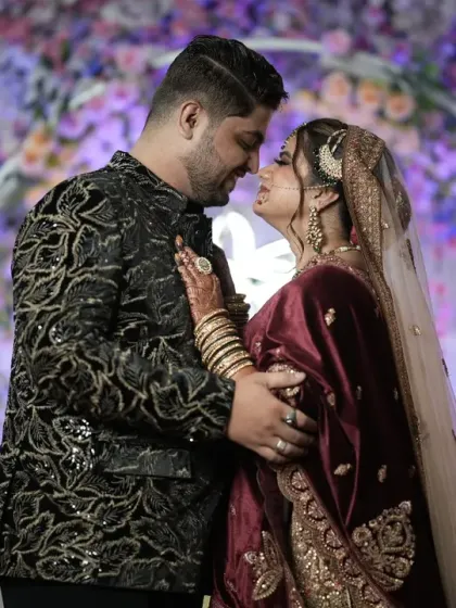 A regal couple portrait from a Muslim wedding reception. We excel at capturing the elegance and grandeur of evening functions, using lighting to create a rich and intimate atmosphere.