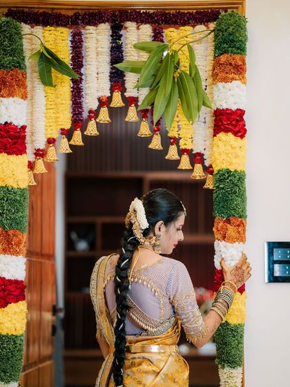 A picture-perfect family celebrating their housewarming. I had the pleasure of dressing my client Archana in a hand-worked blouse, her husband in a custom shirt, and their son in a charming Kalamkari kurta.