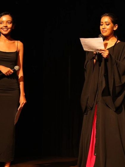 Our founder and a student co-hosting a showcase, highlighting the collaborative spirit of our school.