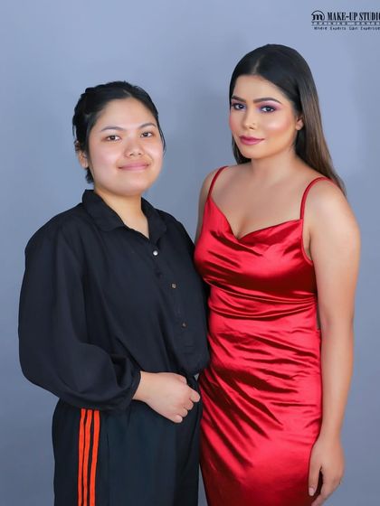 A student from my glam assessment stands with her model. The pride in her work is clear, and she has a stunning photo for her professional portfolio.