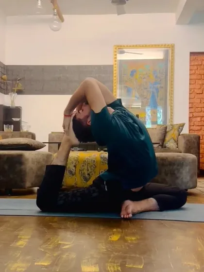 The full expression of Kapotasana (Pigeon Pose), a very deep backbend that requires open shoulders, hip flexors, and a flexible spine.