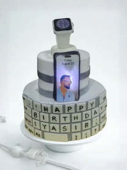 For the tech lover in your life, I create cakes that light up. This custom two-tier cake features an edible keyboard, a fondant Apple Watch, and an illuminated iPhone screen displaying a personal photo. It’s a unique design that’s guaranteed to be a conversation starter.