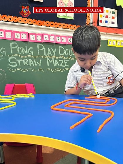 Another student navigates a complex, zig-zagging maze. The difficulty can be adjusted for different age groups, making it a versatile tool for skill development across our pre-primary wing.