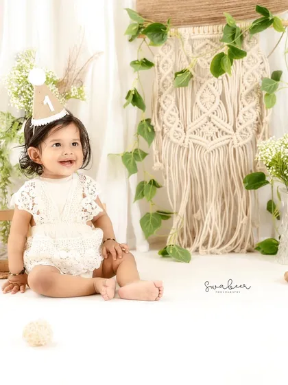 A happy, relaxed smile in a beautiful boho setting. This first birthday session was full of charm and personality.
