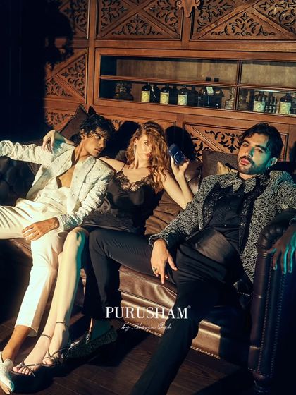 A haven for the night owls. This image captures a relaxed moment of opulence, where every detail, from the lace on her dress to the embroidery on their jackets, tells a story.