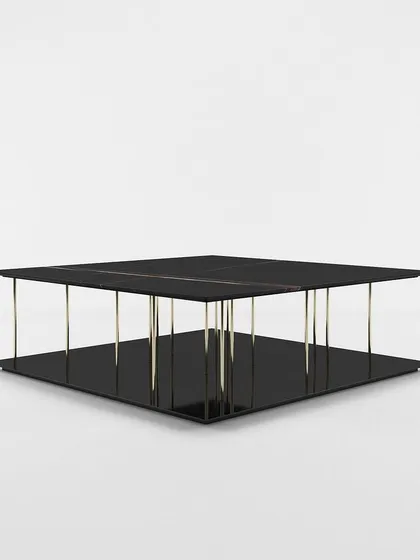 A studio view of our modern two-tier center table, highlighting its minimalist design and the striking contrast between the black surfaces and metallic supports.