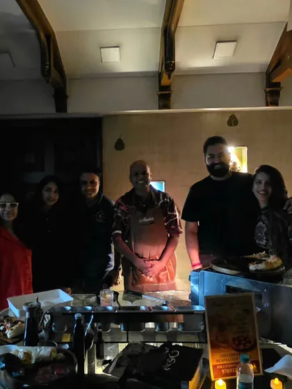 A group photo with guests at a private house party. I love getting to meet so many amazing people who share my passion for great pizza.