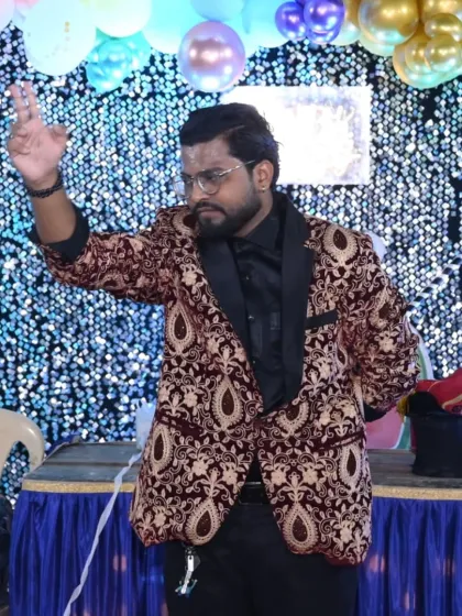 A magical gesture before the grand illusion. The anticipation is part of the fun in every magic performance I give.