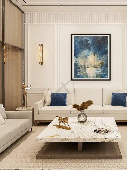 The seating area is defined by classic wall molding and a bold piece of abstract art. The marble coffee table and brass sconces add touches of luxury.