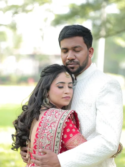 A serene and romantic moment between the couple at their engagement. Her makeup is traditional, elegant, and flawlessly blended.
