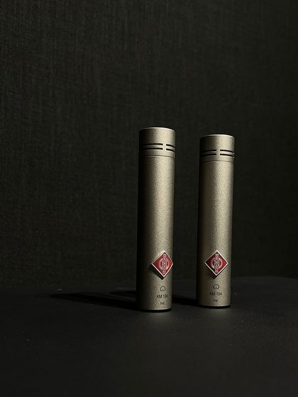 The Neumann KM184 is a small-diaphragm condenser microphone renowned for its clarity and detail, making it a perfect choice for recording acoustic instruments like guitar and piano.