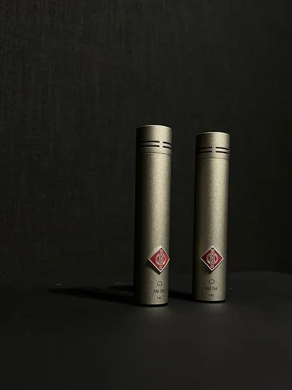 The Neumann KM184 is a small-diaphragm condenser microphone renowned for its clarity and detail, making it a perfect choice for recording acoustic instruments like guitar and piano.
