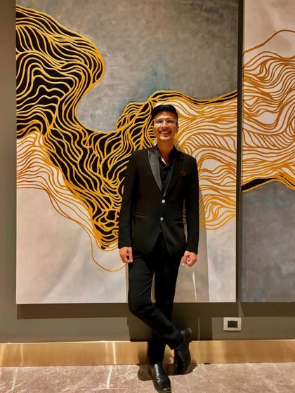 A moment of joy before a Diwali-themed corporate show. The art on the wall perfectly matched the vibrant energy of the evening.