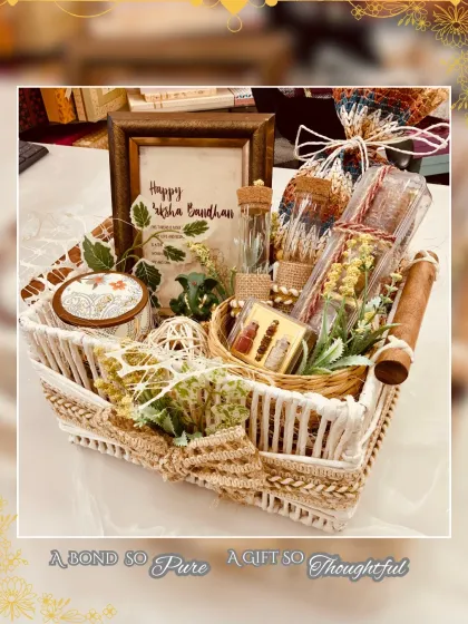 A bond so pure, a gift so thoughtful. This beautiful woven basket includes a personalized "Happy Raksha Bandhan" frame, a decorative jar, and other curated items for a heartfelt gift.