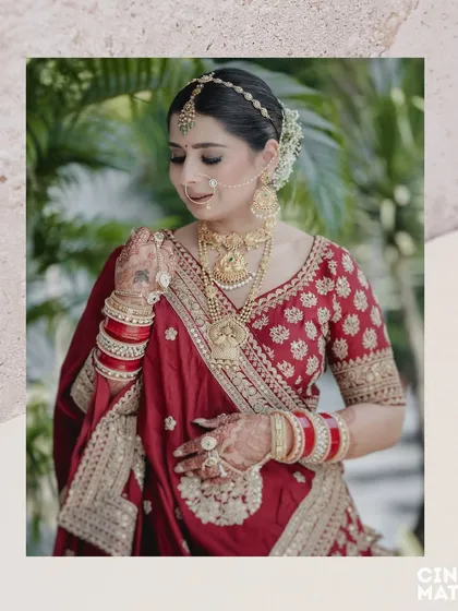 A beautiful three-quarter portrait of the bride, showcasing her henna, bangles, and the elegant fall of her sari.