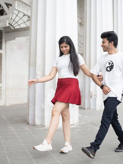 A playful, walking shot of a couple in Mumbai. I capture these candid, in-between moments that show the easy comfort and connection between two people.