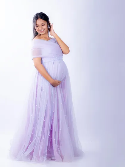 Another beautiful shot of our Breezy gown. The off-shoulder neckline and flowing tulle are incredibly flattering and comfortable.