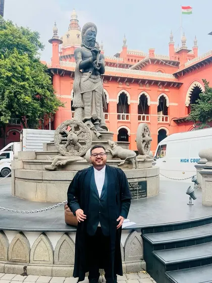 Outside the Madras High Court, where I handled a complex cheque bounce case valued at ₹2.45 Crores. We successfully argued for the case to be transferred to a different court to ensure a fair and impartial trial, free from potential bias. This victory set a valuable precedent for similar cases under the Negotiable Instruments Act.