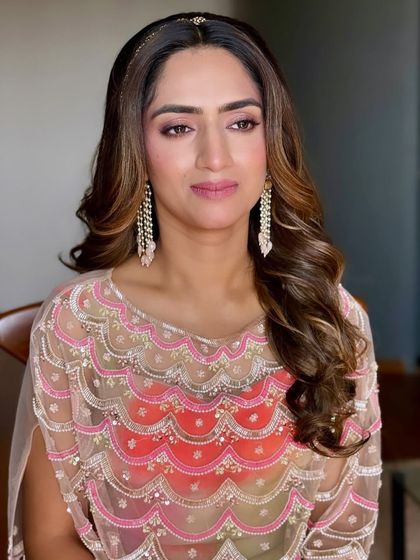 Dainty beauty and soft hues. This look is perfect for a bride or bridesmaid, featuring soft pink makeup and a simple, elegant headband.