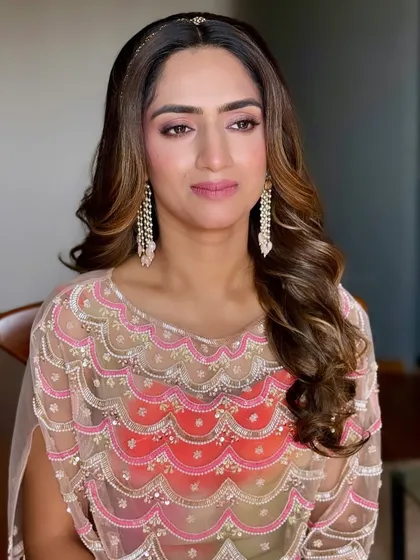 Dainty beauty and soft hues. This look is perfect for a bride or bridesmaid, featuring soft pink makeup and a simple, elegant headband.