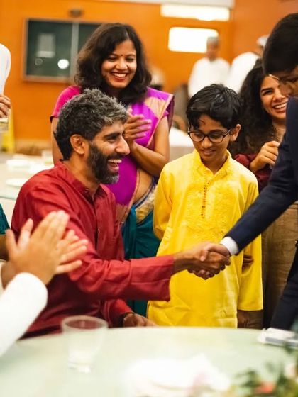 A handshake after a successful trick. It's a moment of connection and appreciation, the perfect end to a personal magical experience.