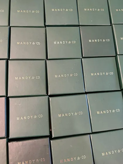 A grid of my signature Mandy & Co. hard boxes, showcasing my premium packaging for bulk orders.