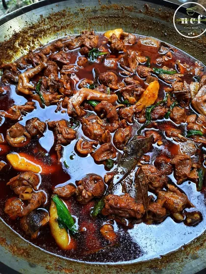 My signature NCF duck curry, full of rich flavors and tender meat. You can see the chicken feet and spices that make this dish so special.