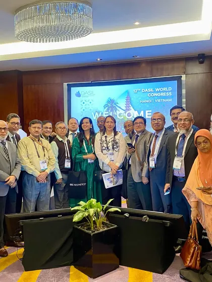 A group photo with a delegation of doctors at the DASIL Congress in Hanoi. It's inspiring to connect with professionals from so many different countries.