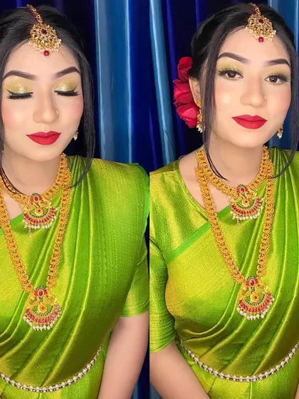 A South Indian inspired bridal look. I used a vibrant green eyeshadow to complement her silk saree and paired it with a bold red lip and traditional temple jewelry for a stunning result.