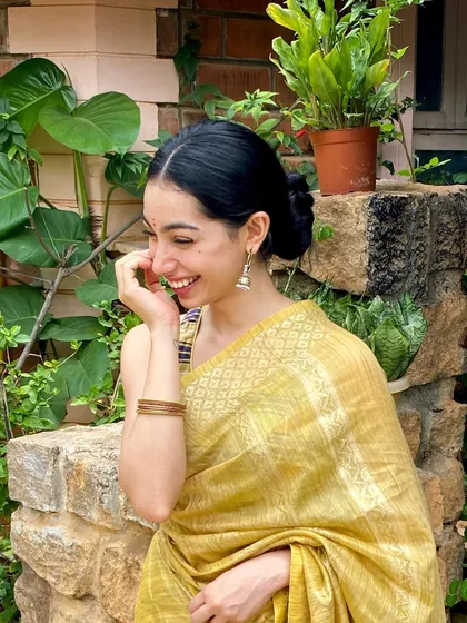 A candid laugh during a festive photoshoot. These moments of genuine happiness are often the best ones.